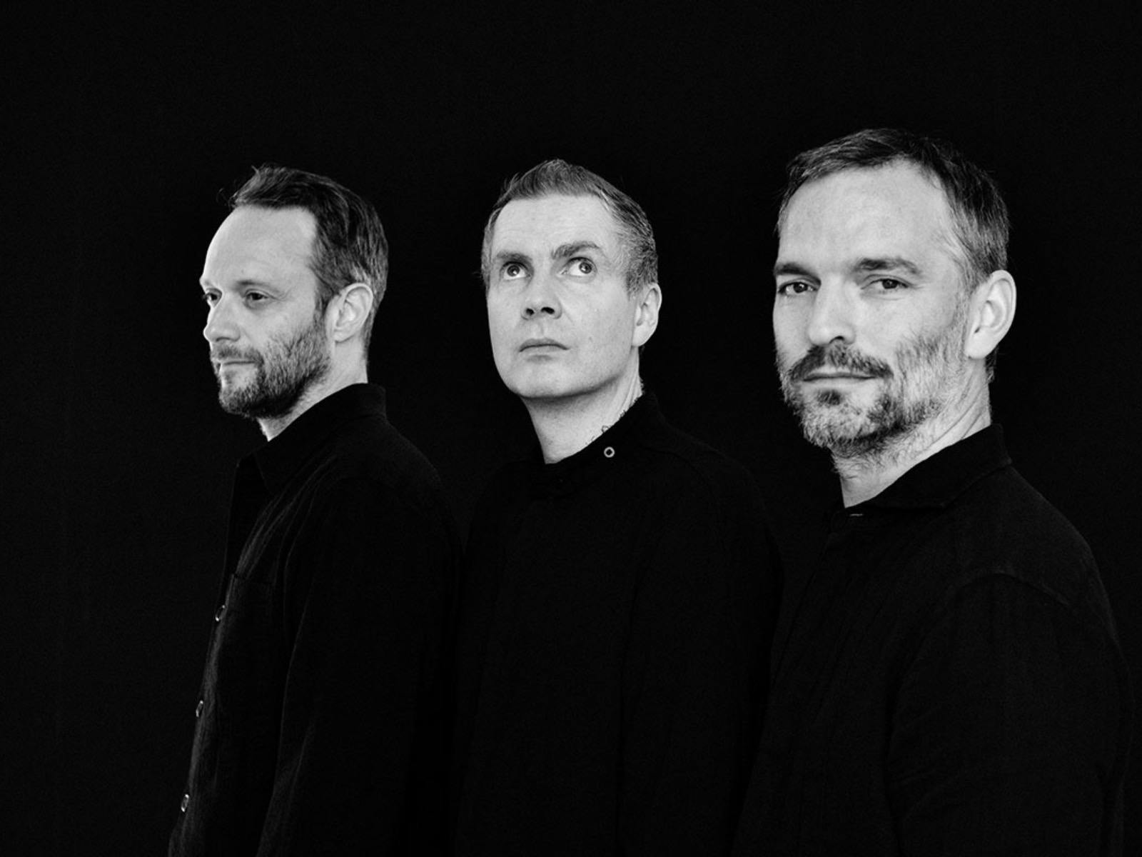 A black and white portrait of trio Sigur Rós