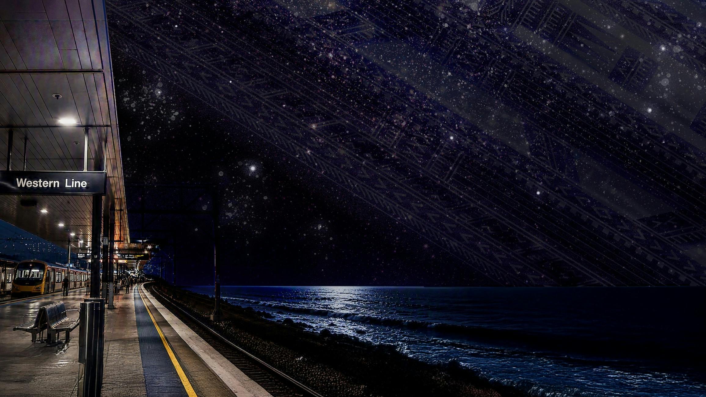 An empty Western Line platform stretches beside a dark ocean under a star-filled sky,