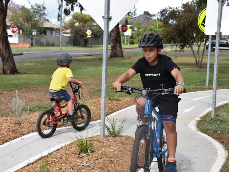 Two boys on push-bikes