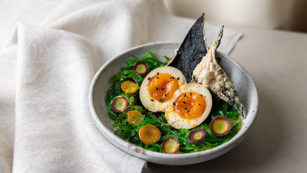 Soy marinated egg, fried nori chip, wakame