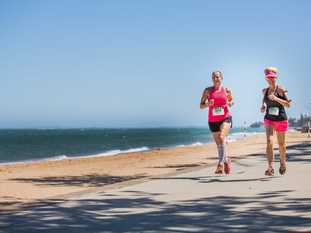 Runners running along Suttons Beach