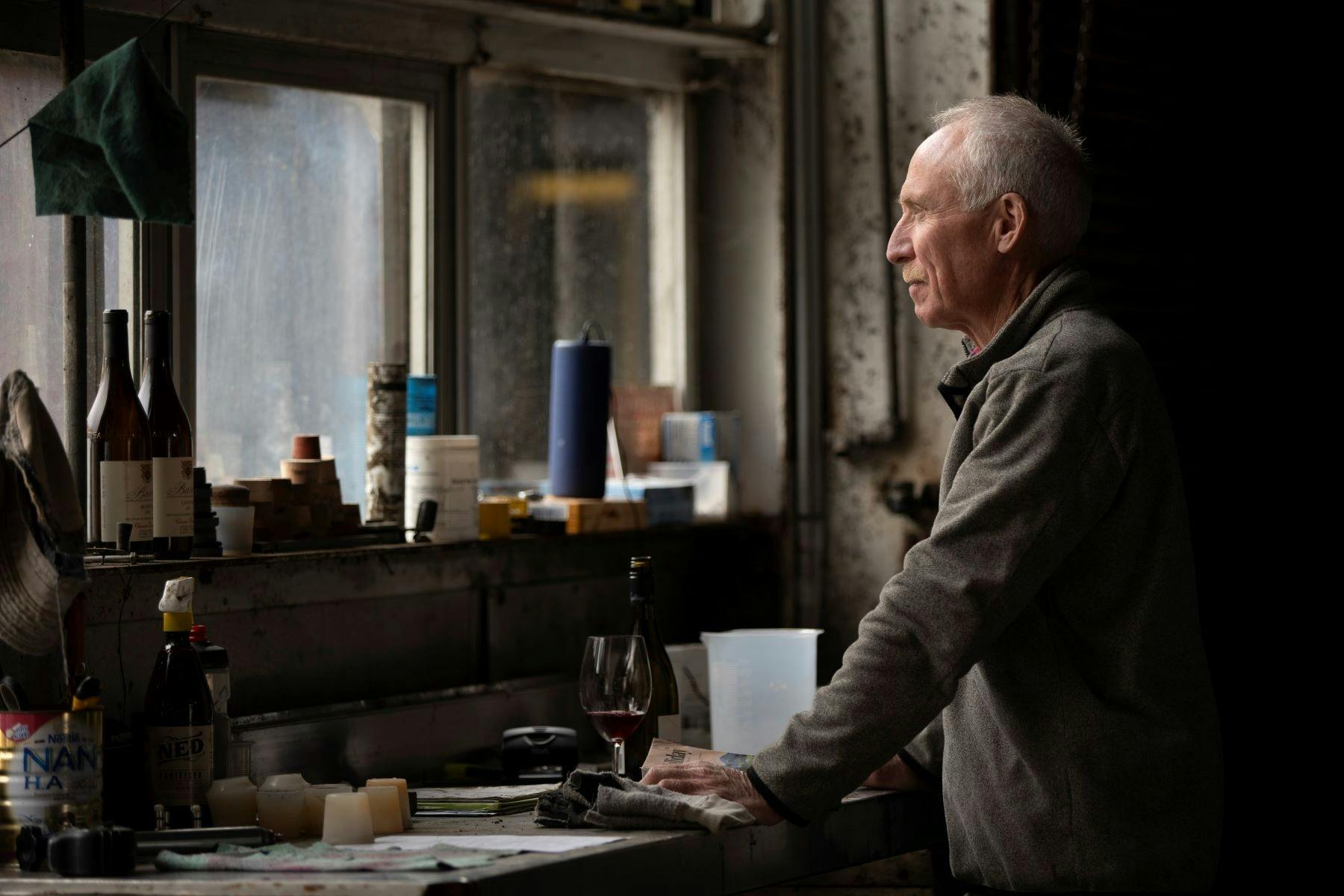 Mark Walpole, in his winery, reflecting, looking out in the Mayday Hills courtyard