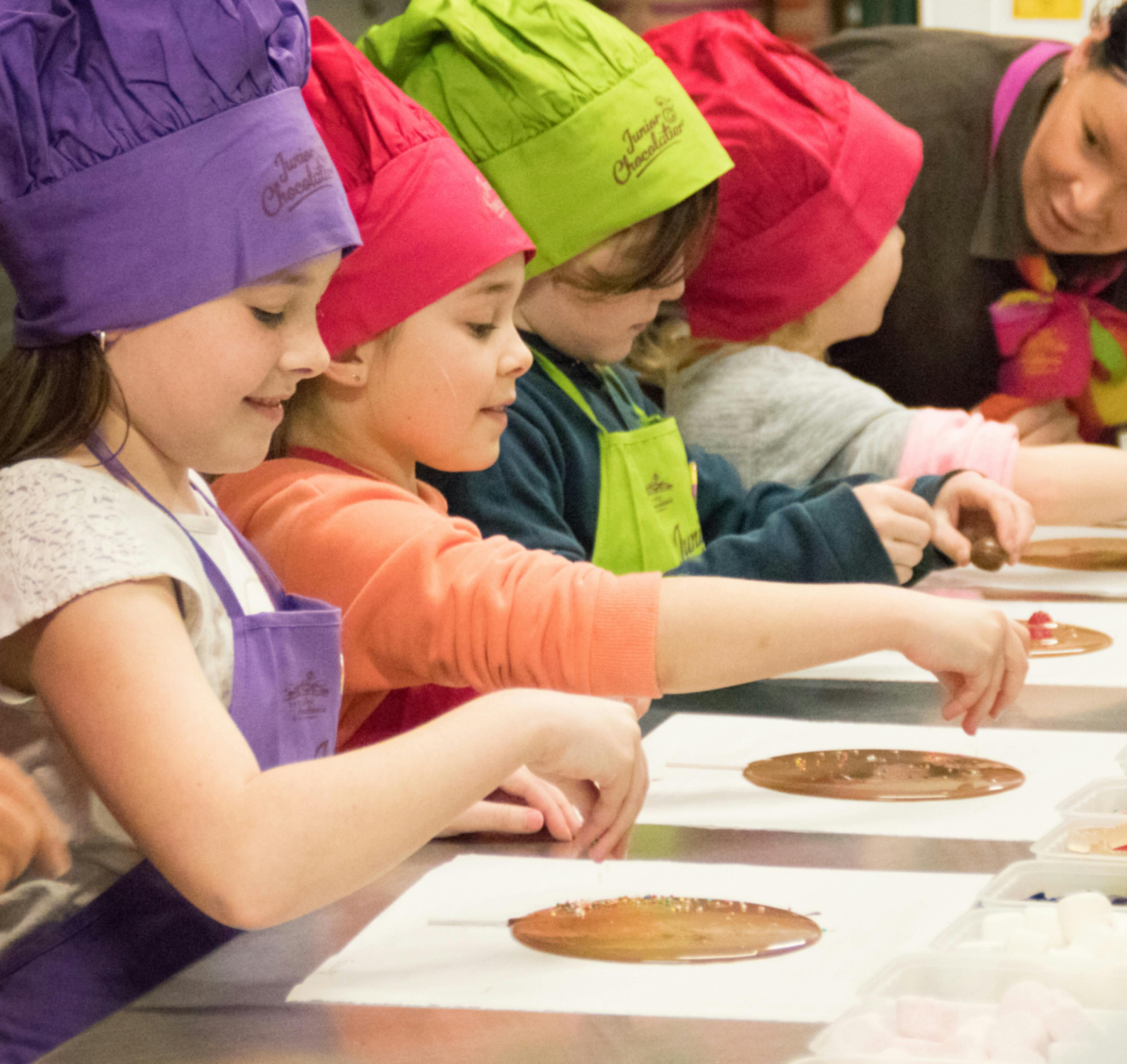 children creating lollipops