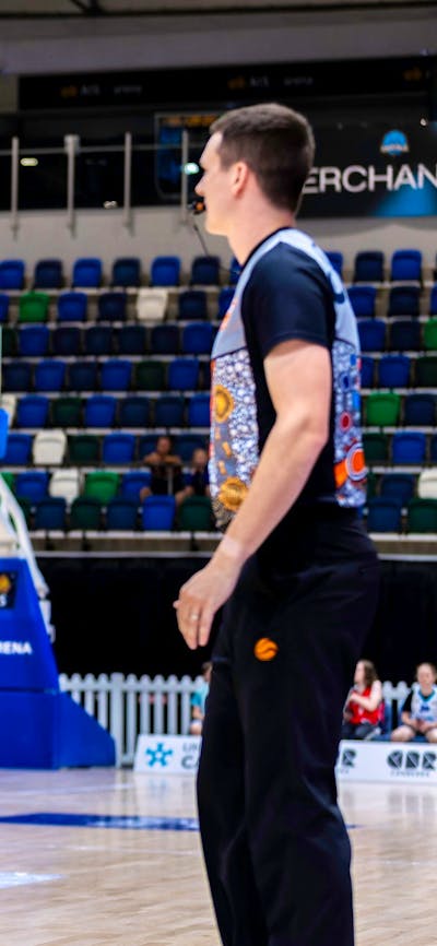 UC Capitals player shooting the basketball while a defender closes in.