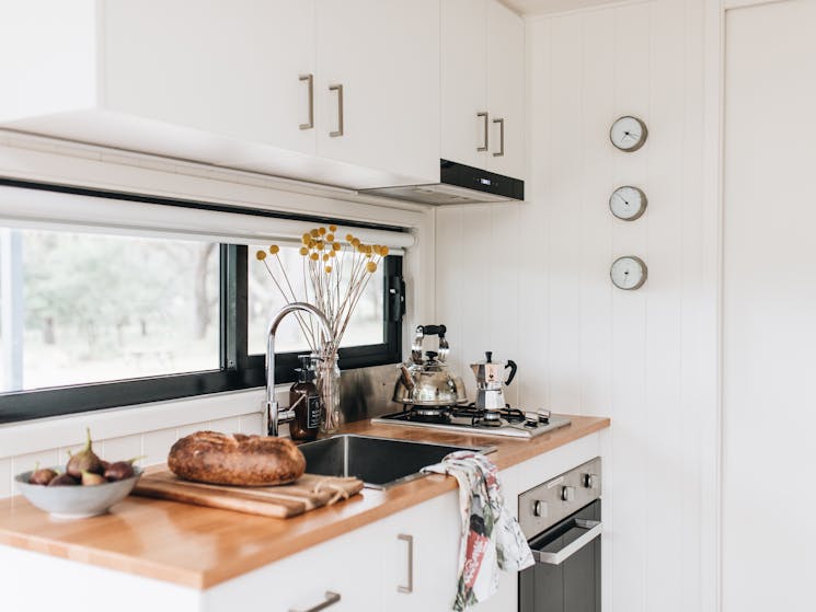 Kitchen with sink, oven and stove