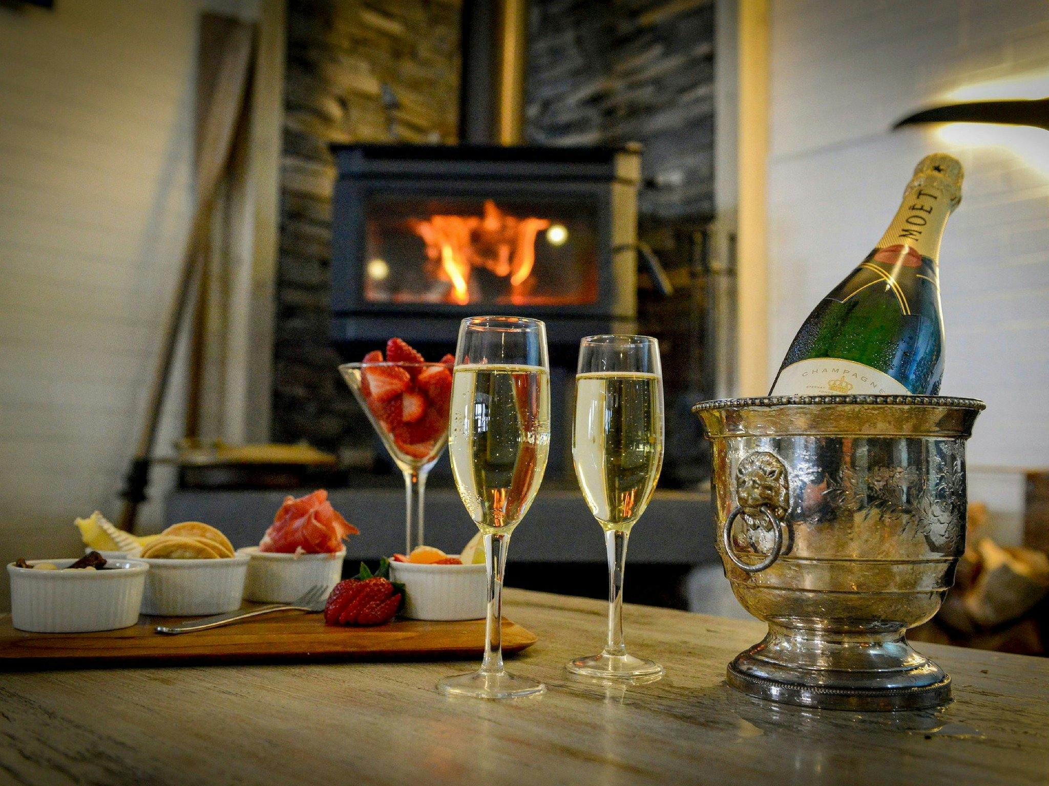 fire, champagne, cheese plate