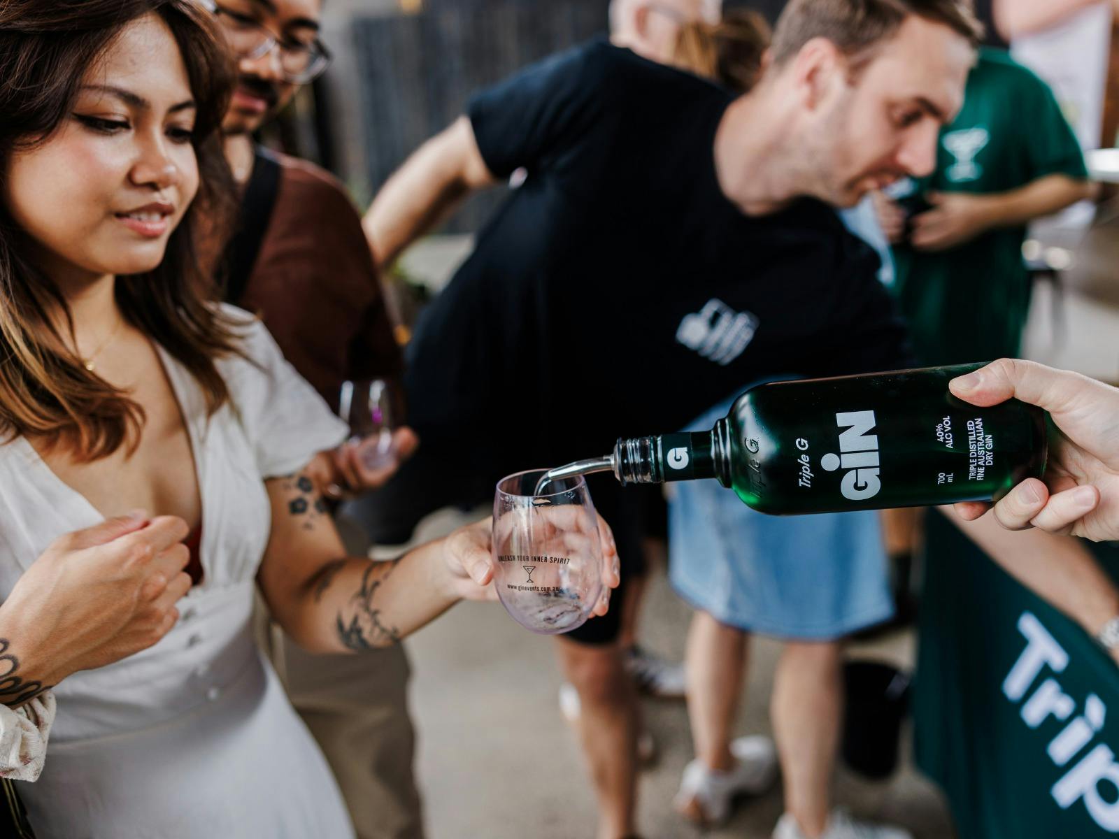 Bottle pouring gin Bottle pouring gin