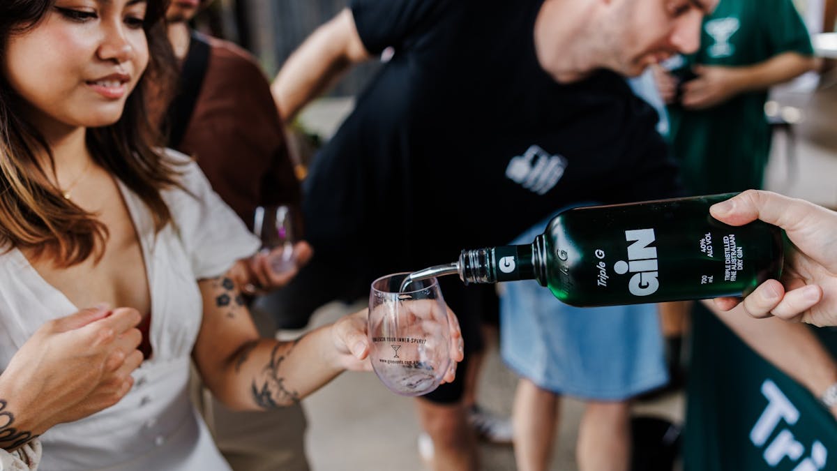 Bottle pouring gin