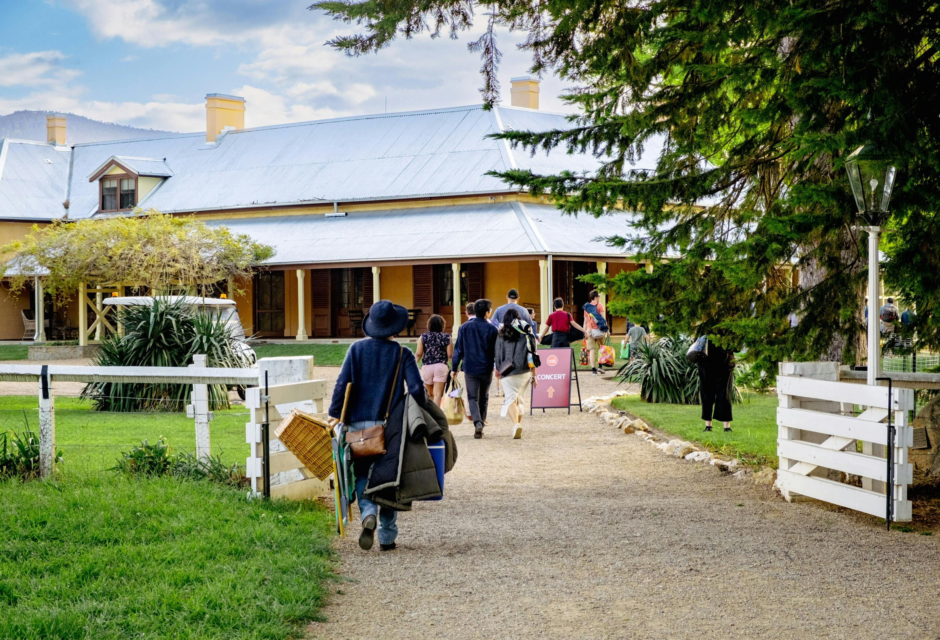 Crowd walking in Lanyon Homestead gates