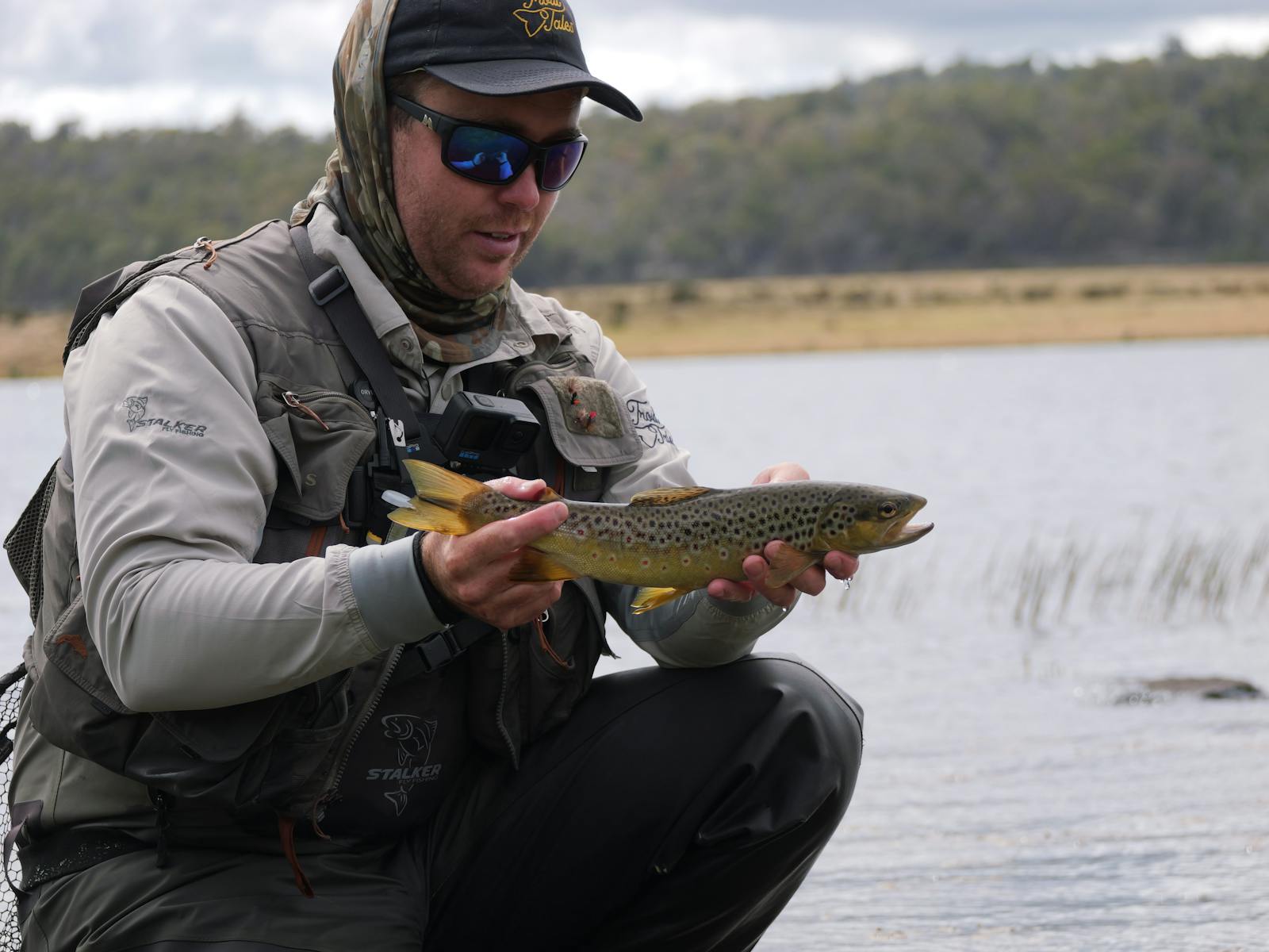 Matt in hat holding trout