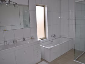 The second bathroom features a separate shower and full size bath.