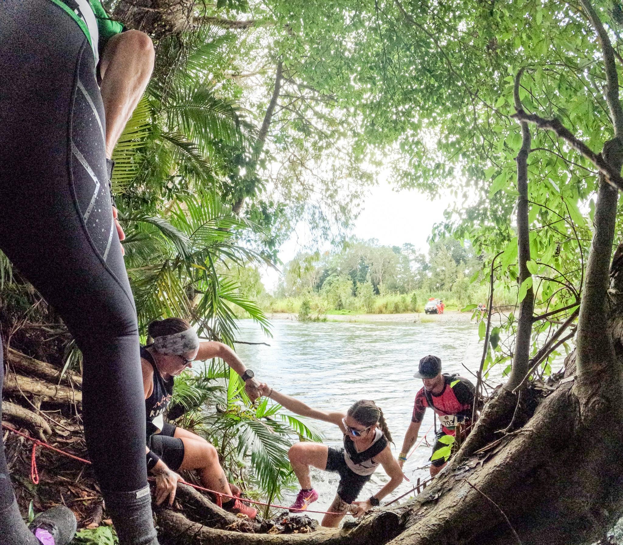 Runner climbing out of creek