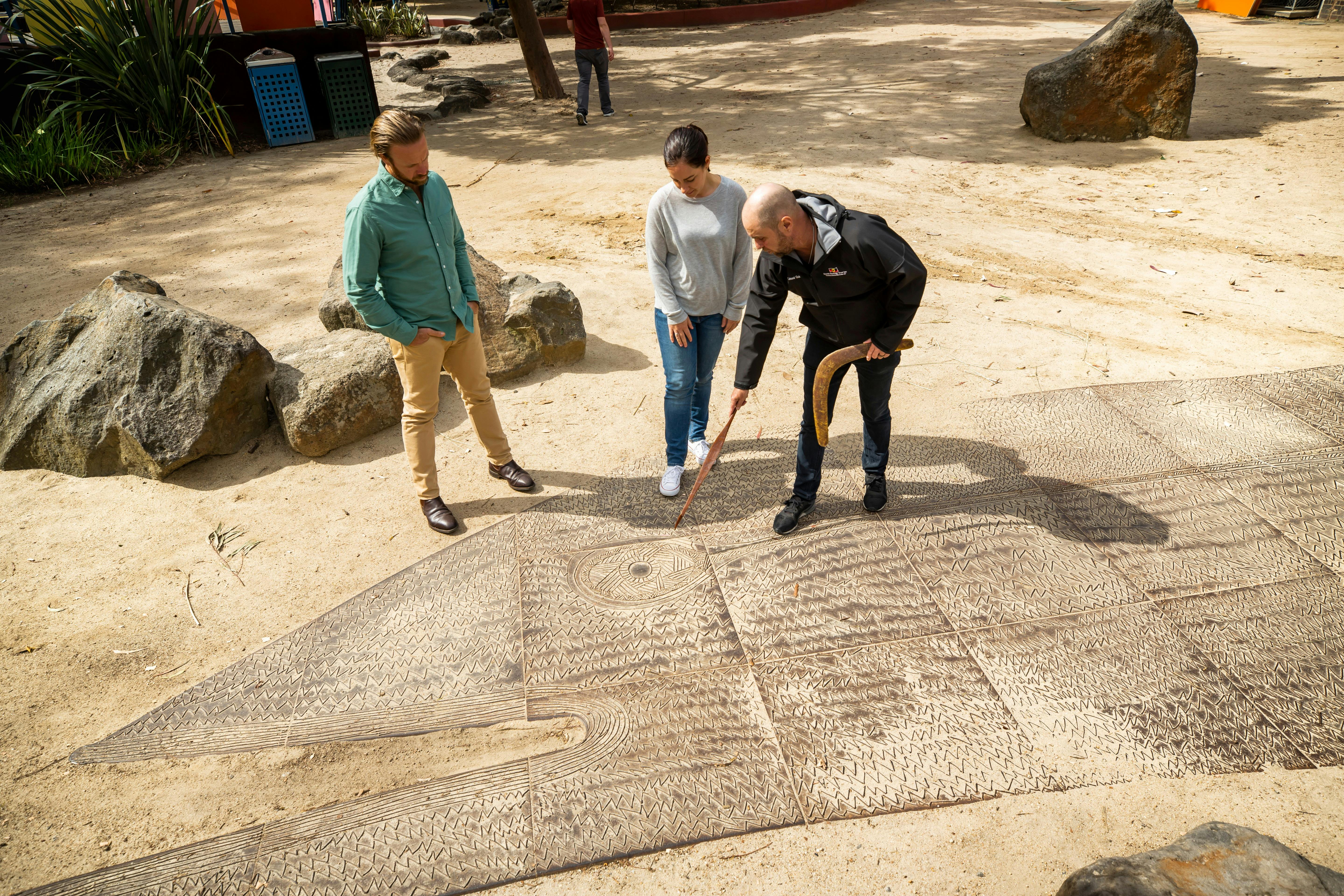 A group of people looking at an art installation.
