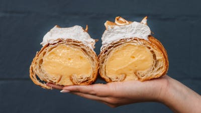 pastry being held in the air at Wildflour Canberra
