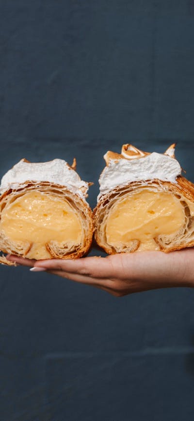 pastry being held in the air at Wildflour Canberra