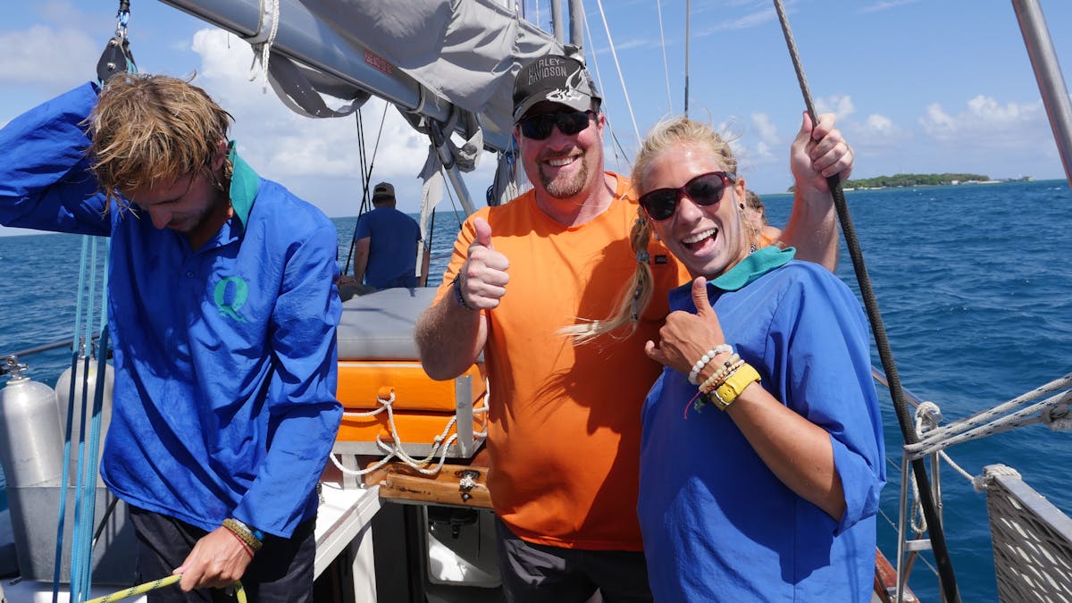Crew and guest after hoisting sail on Ocean free, Great barrier Reef fun and adventure Crew and guest after hoisting sail on Ocean free, Great barrier Reef fun and adventure