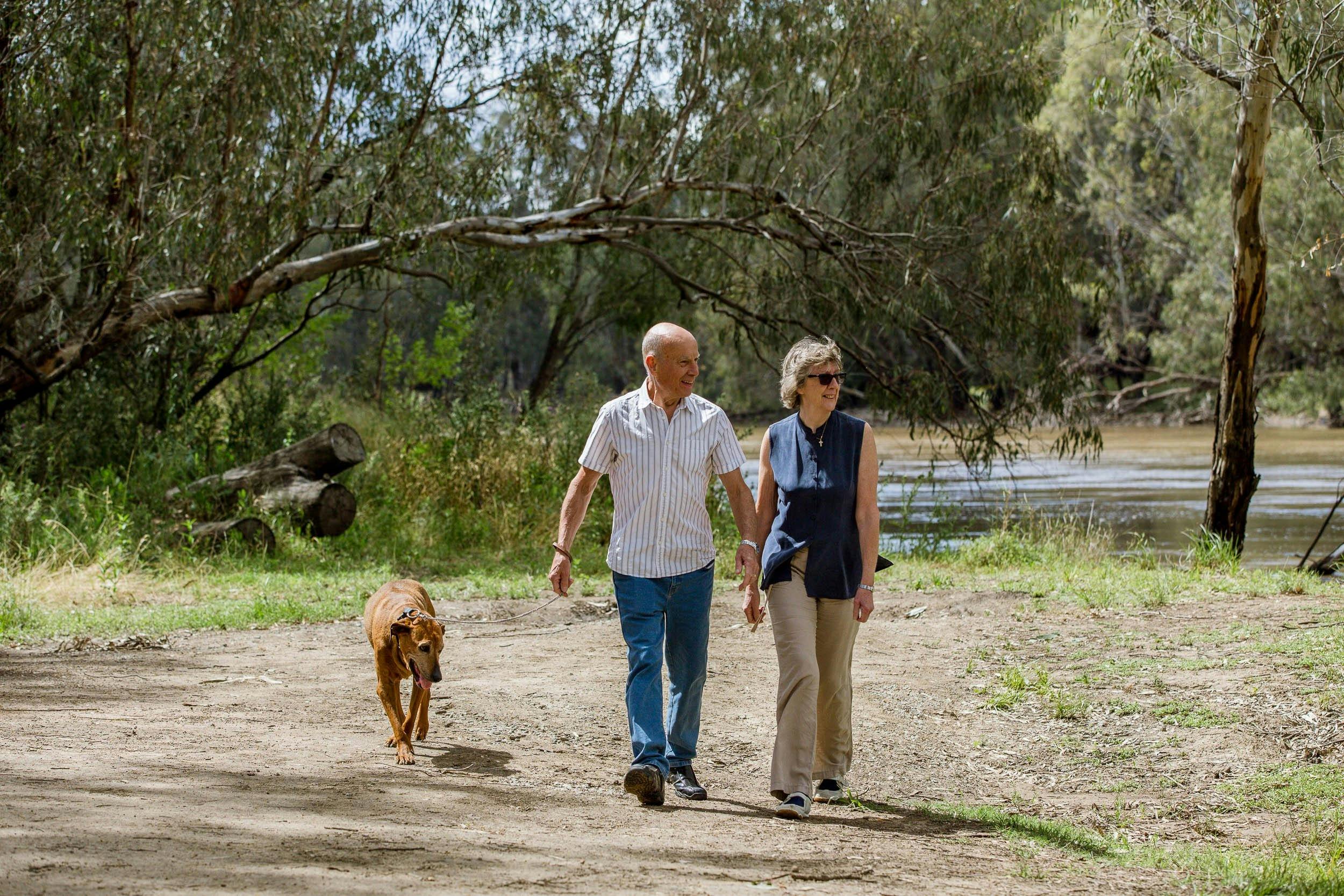 Couple walking along Murrumbidgee River