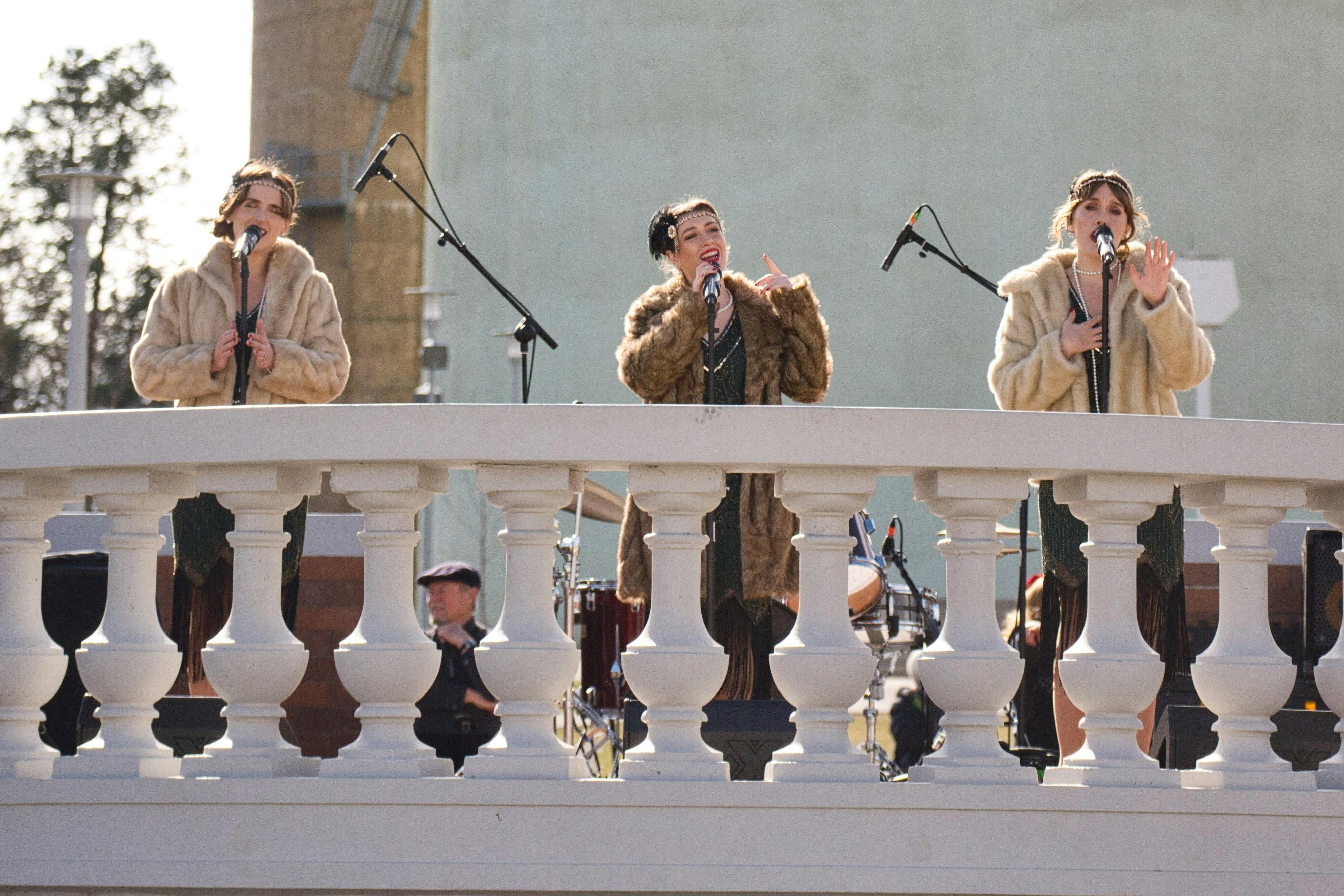 The Wild Tonics singing at Chelmsford Place with Leeton’s Art Deco water towers in the background.