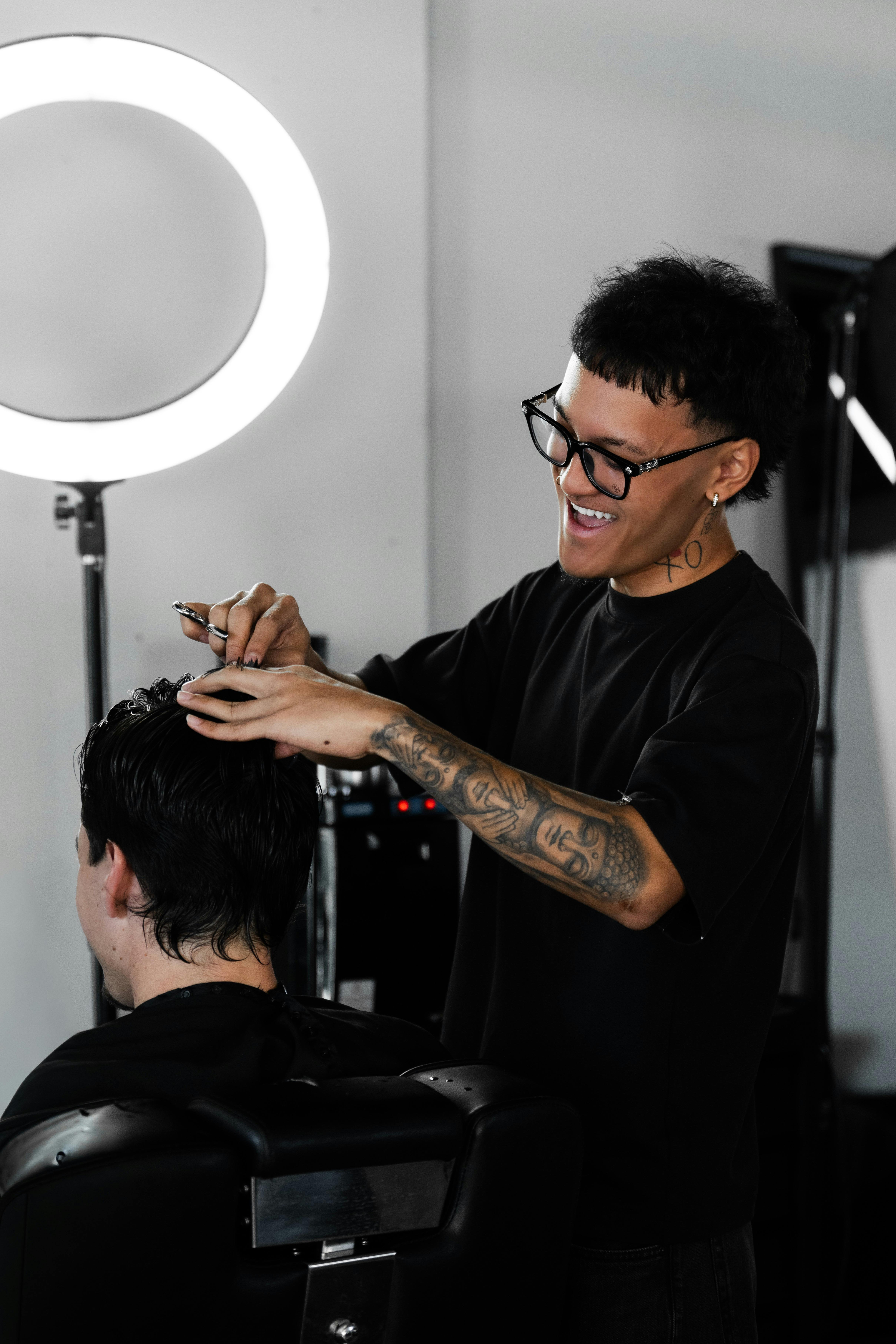 Our barber providing a precision haircut to a client at FANAEIANS Barber & Spa