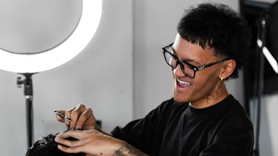 Our barber providing a precision haircut to a client at FANAEIANS Barber & Spa