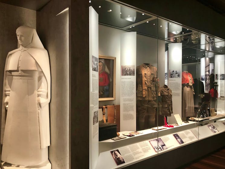 A Centenary Exhibition showcase featuring a reproduction of Rayner Hoff's Matron