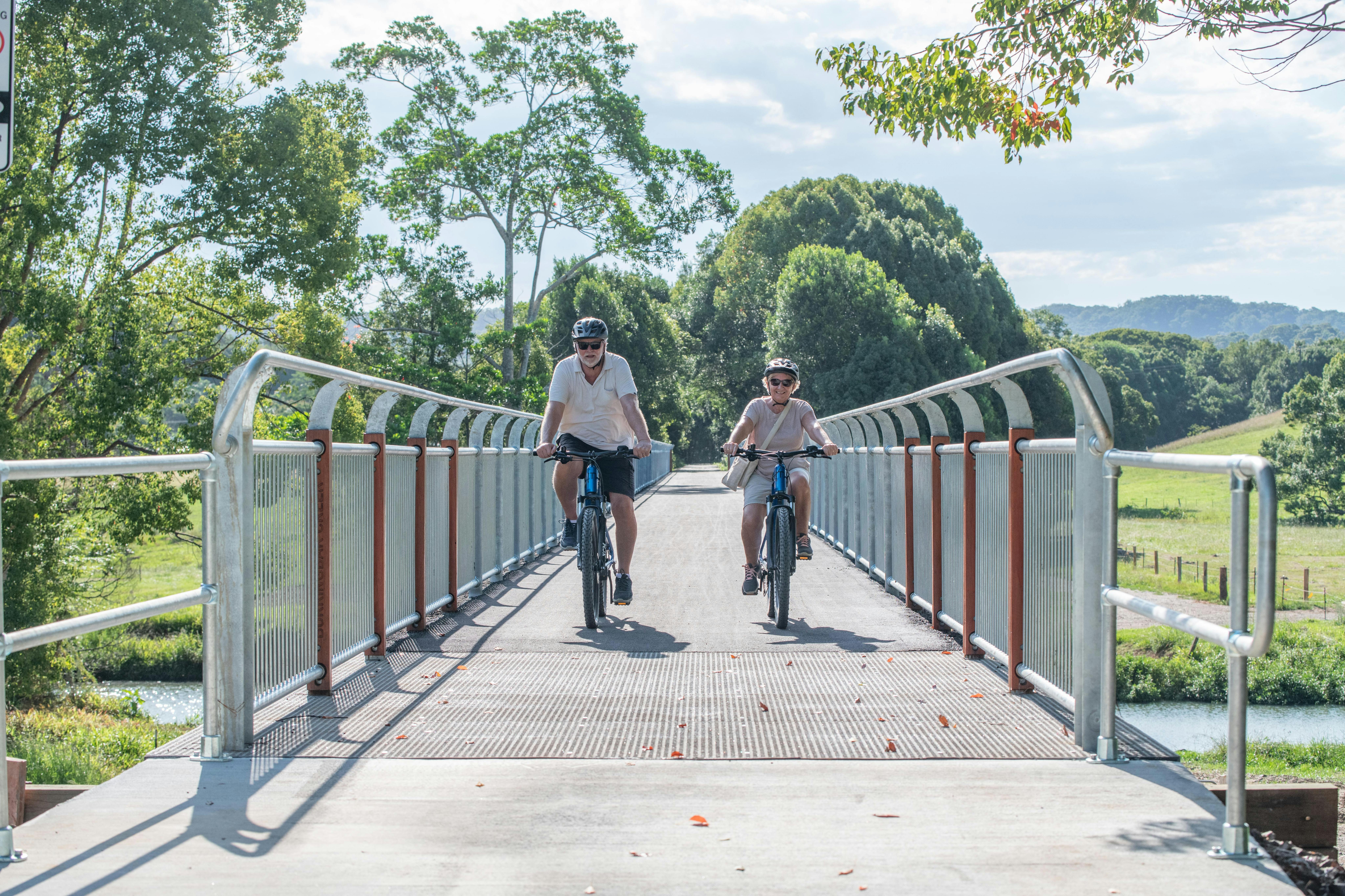 Rider crossing the longest bridge on the Northern Rivers Rail Trail with Better By Bike