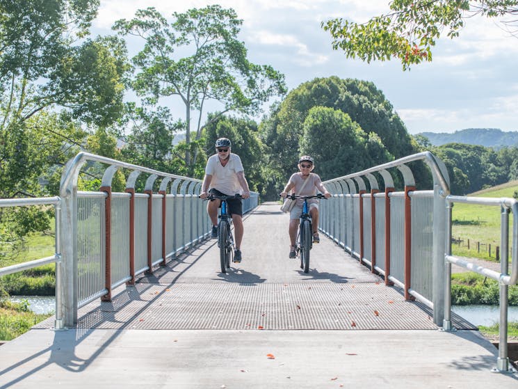 Rider crossing the longest bridge on the Northern Rivers Rail Trail with Better By Bike