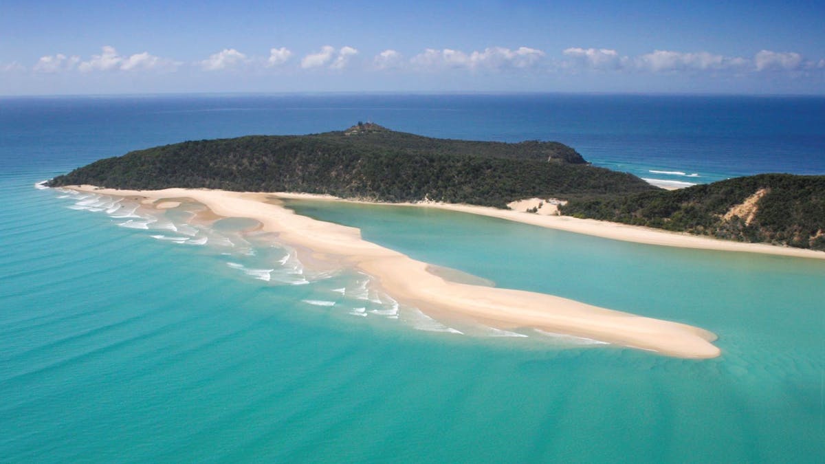 Aerial shot of Double Island Point with the beach and water view
