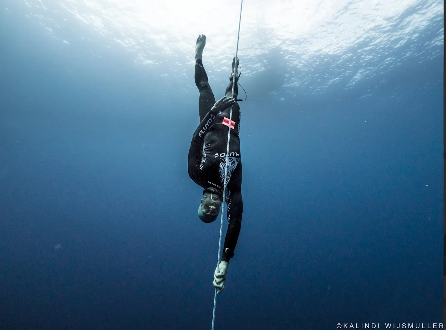 Australian Freediver Adam Sellars freediving without fins, pulling himself down the line