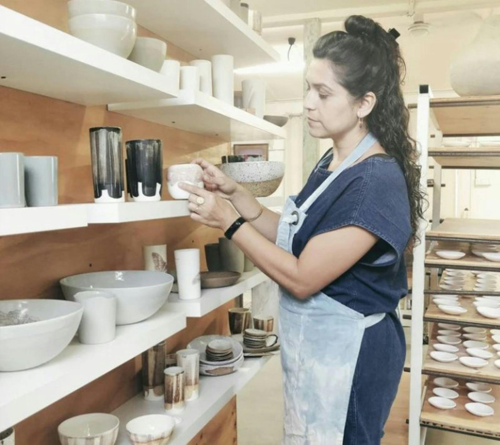 Lady looking at pottery