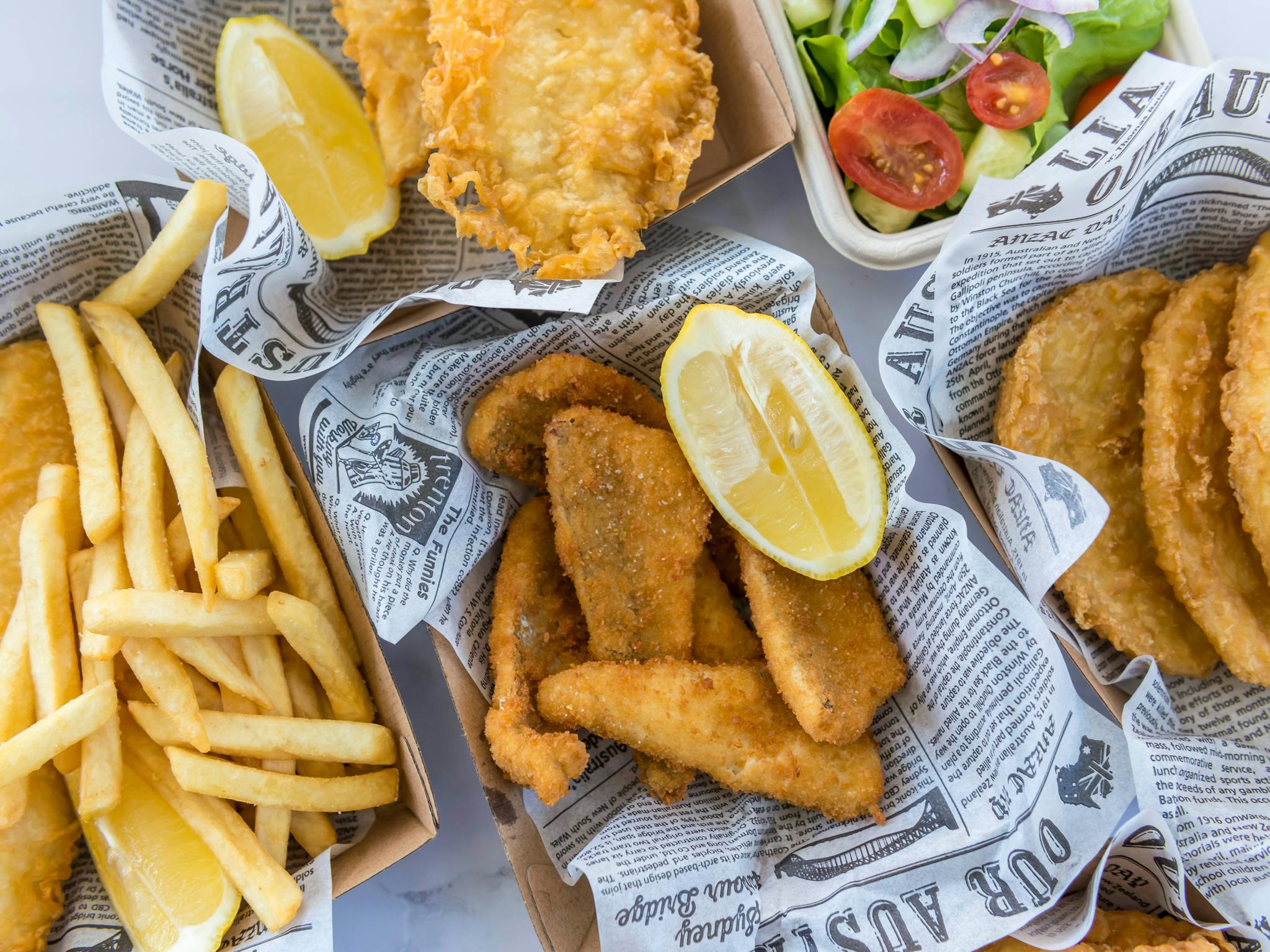 Image of fish and chips in take away boxes