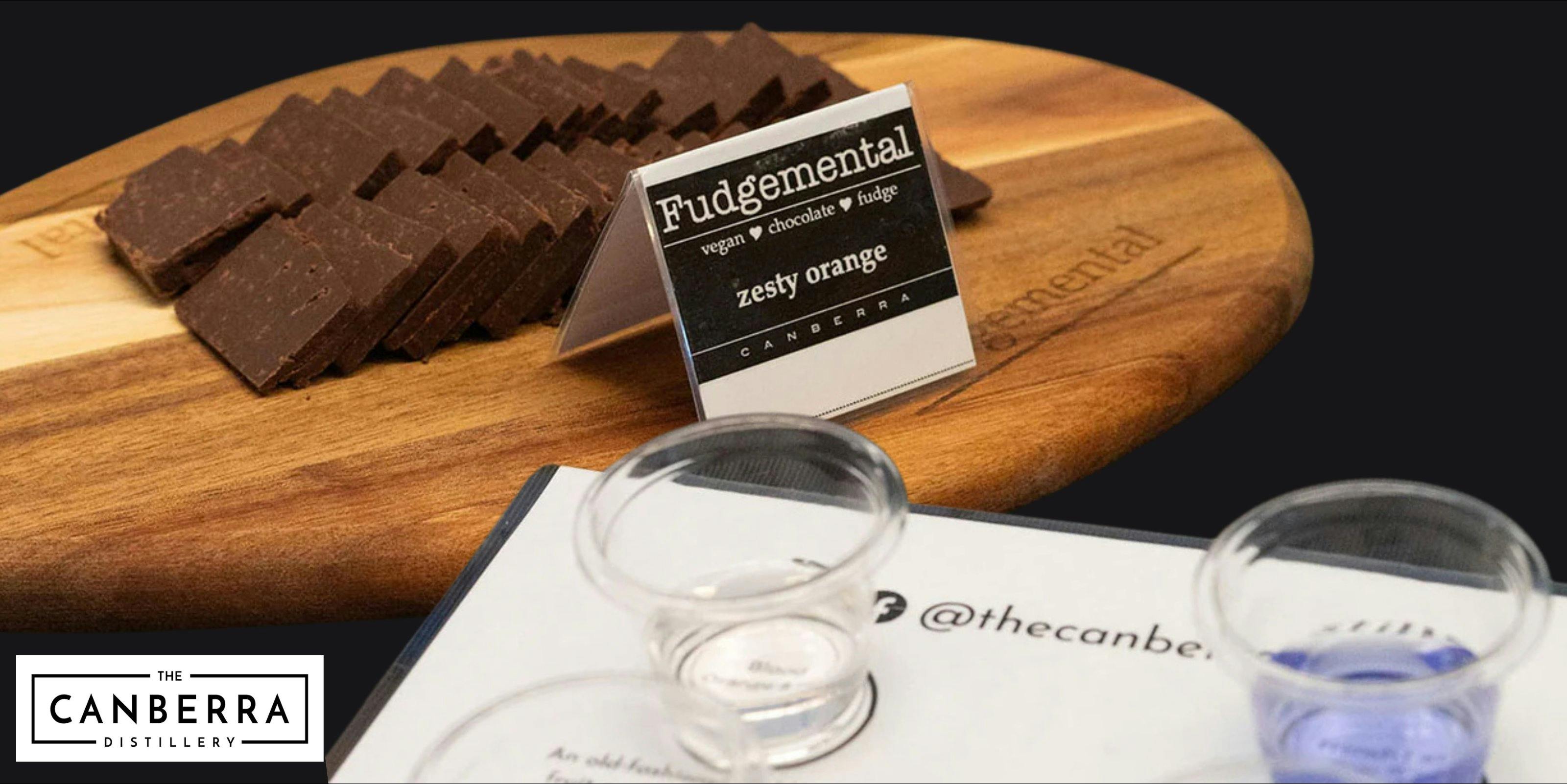 fudge on a wooden platter and tasting glasses of gin