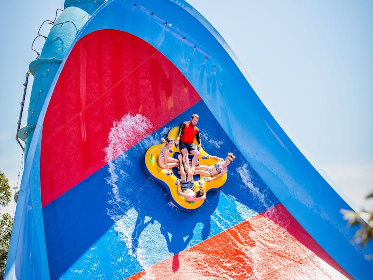 Four people on water slide