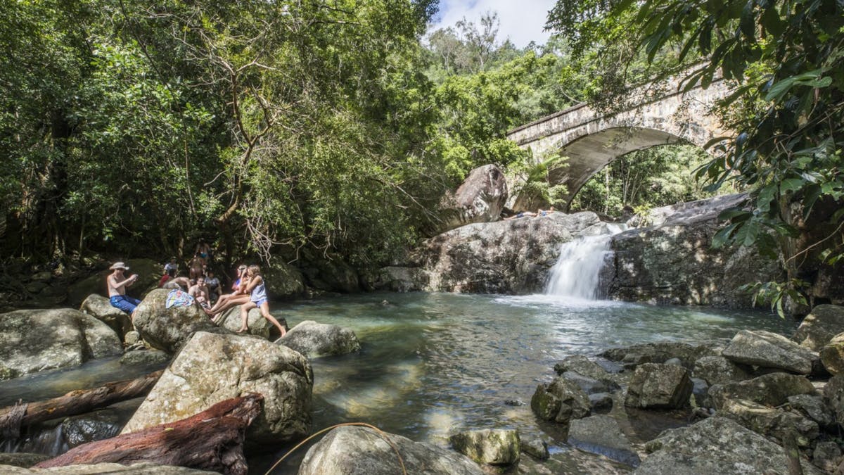 People with water and bridge