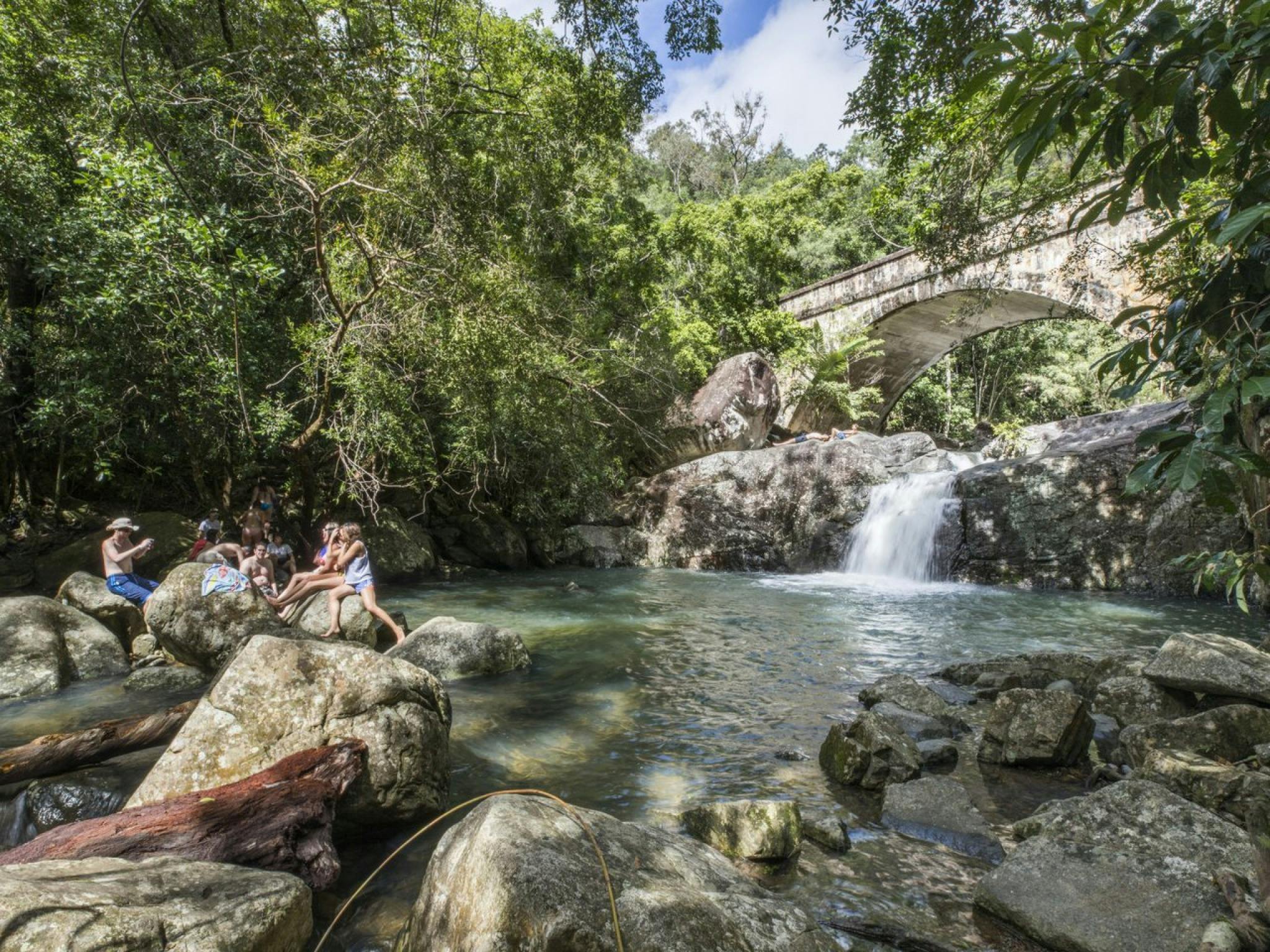People with water and bridge