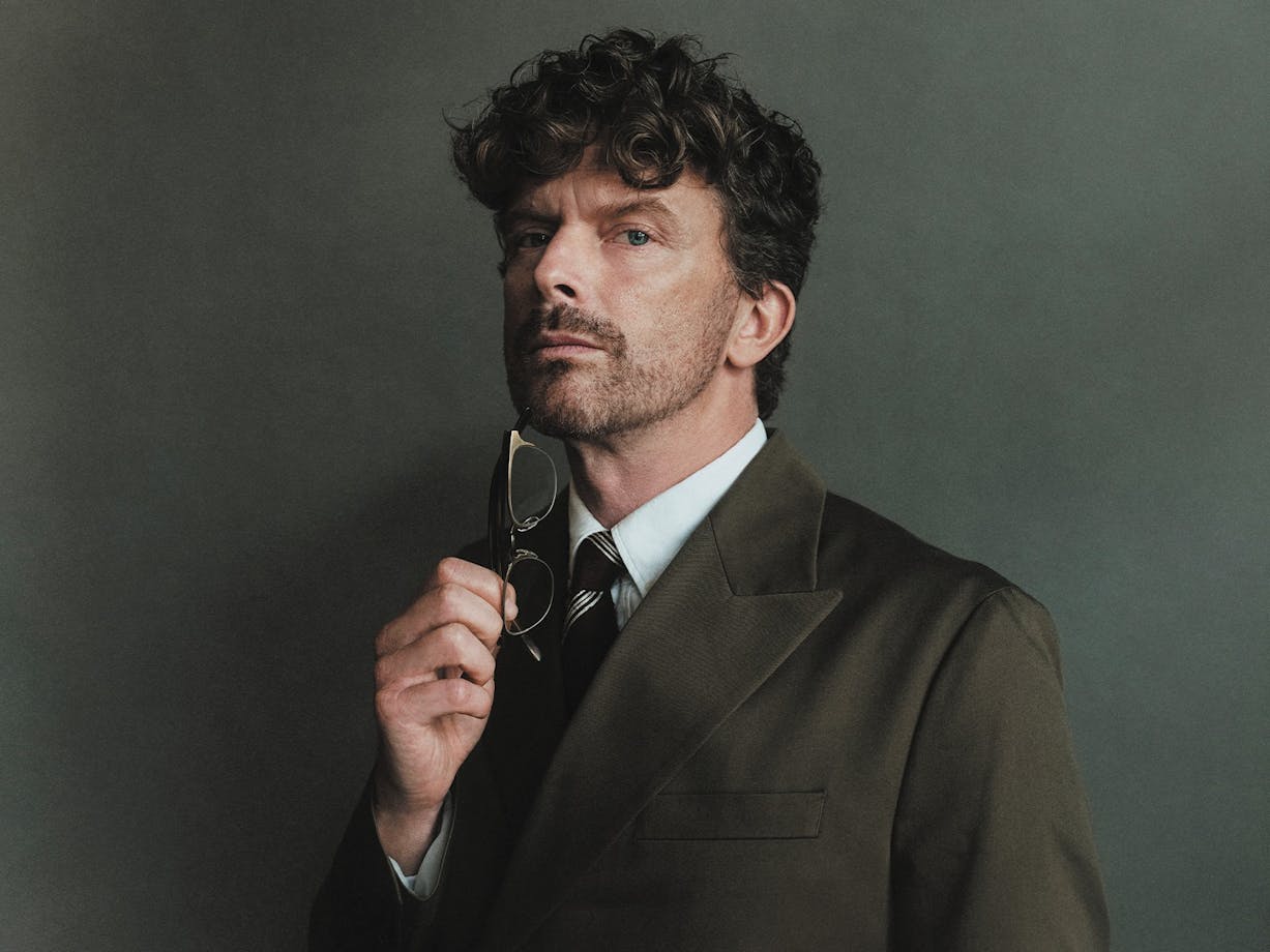 A close shot of a man holding glasses