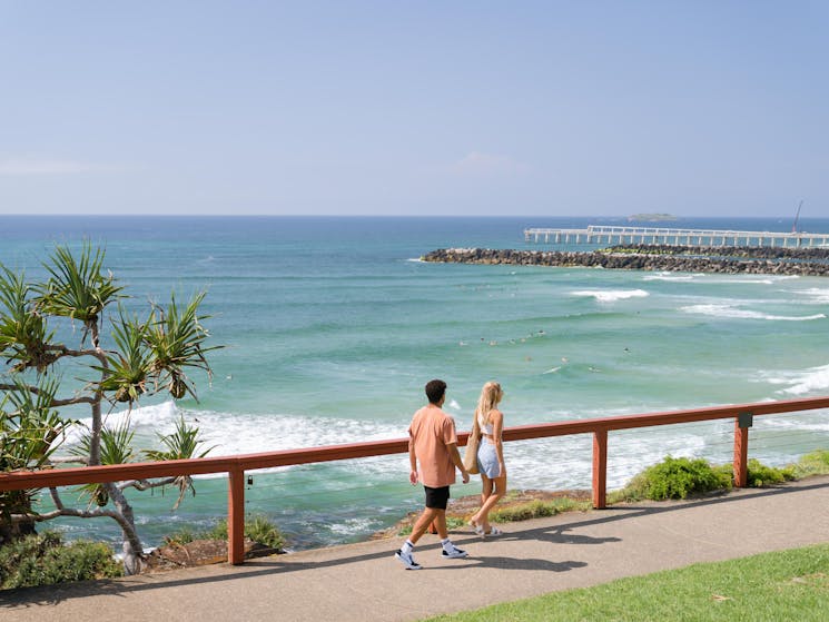 Couple walking at Point Danger Lookout