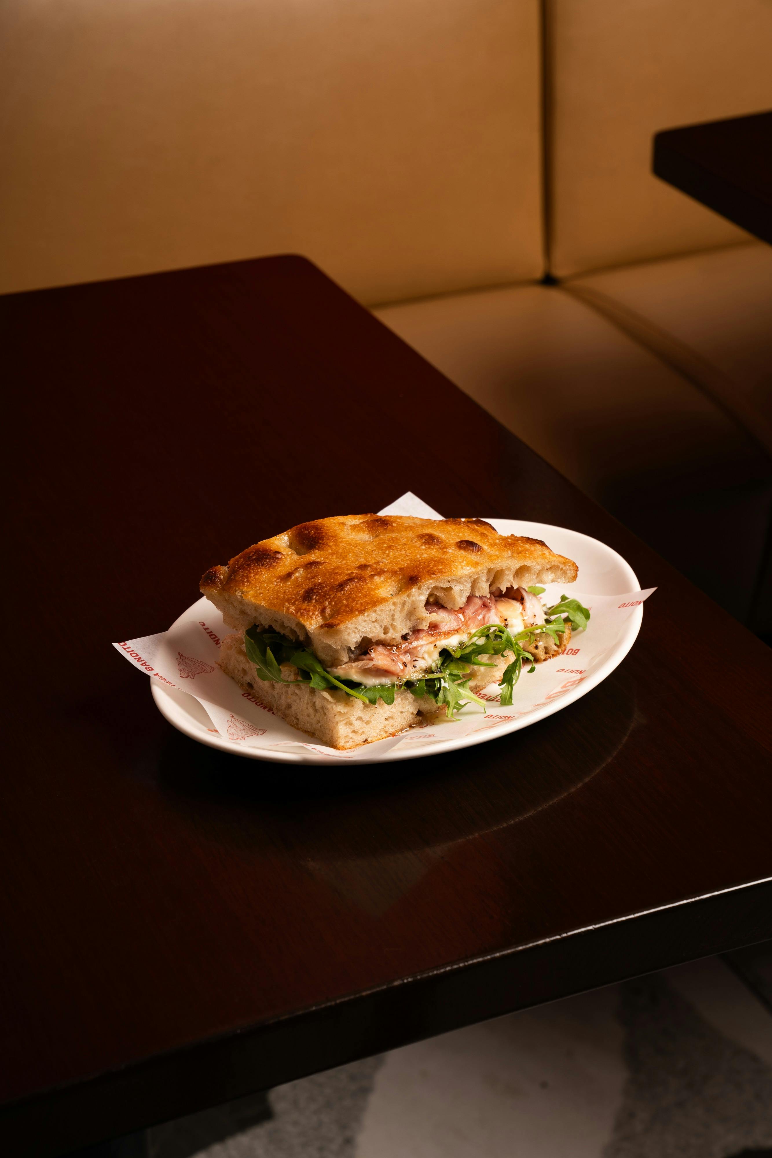Our Prosciutto sando is a Bottega Bandito staple: San Danielle prosciutto, peppers, stracciatella