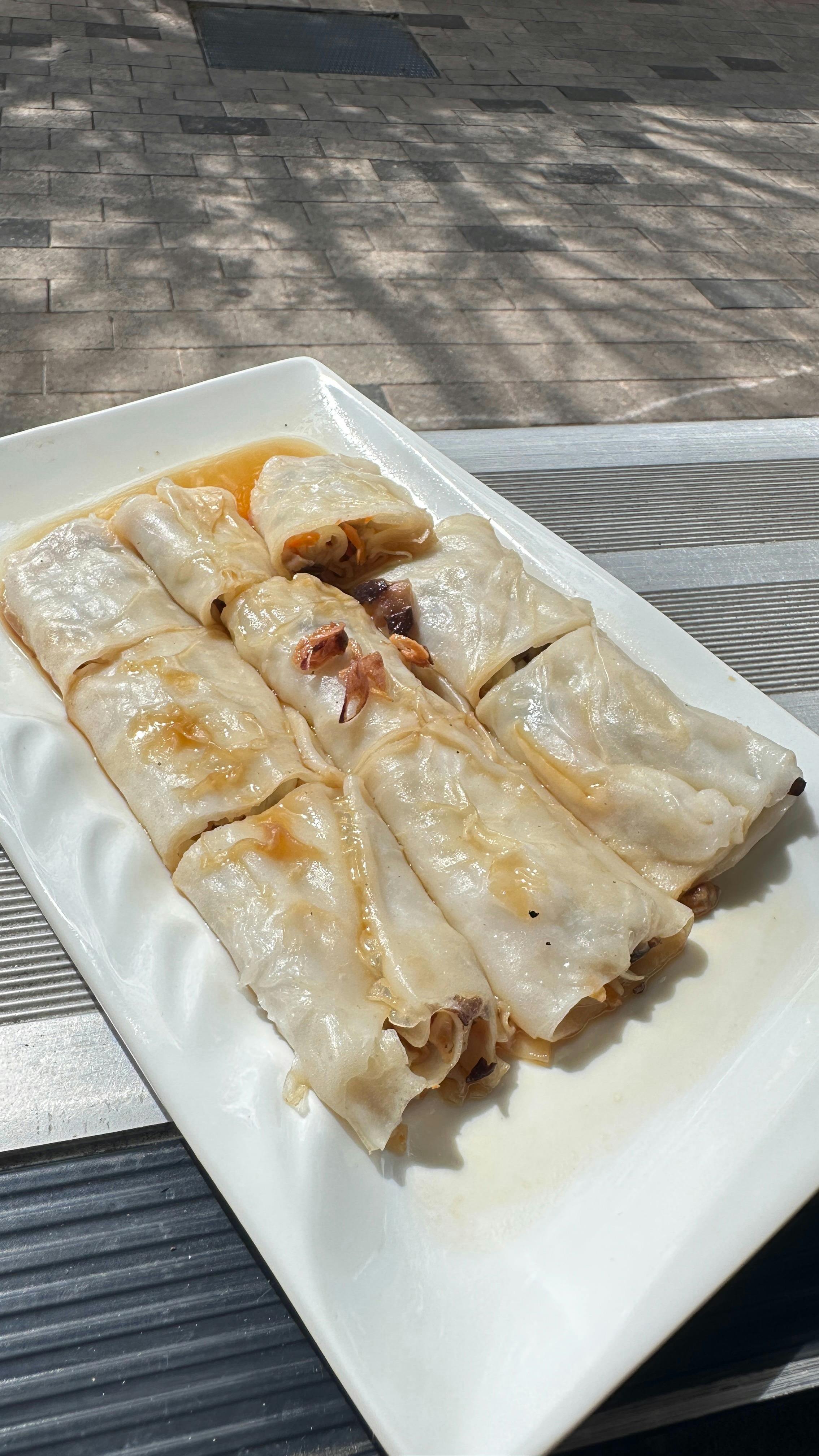 Steamed mushroom rice rolls topped with mushrooms, fried shallots, and sweet soy sauce