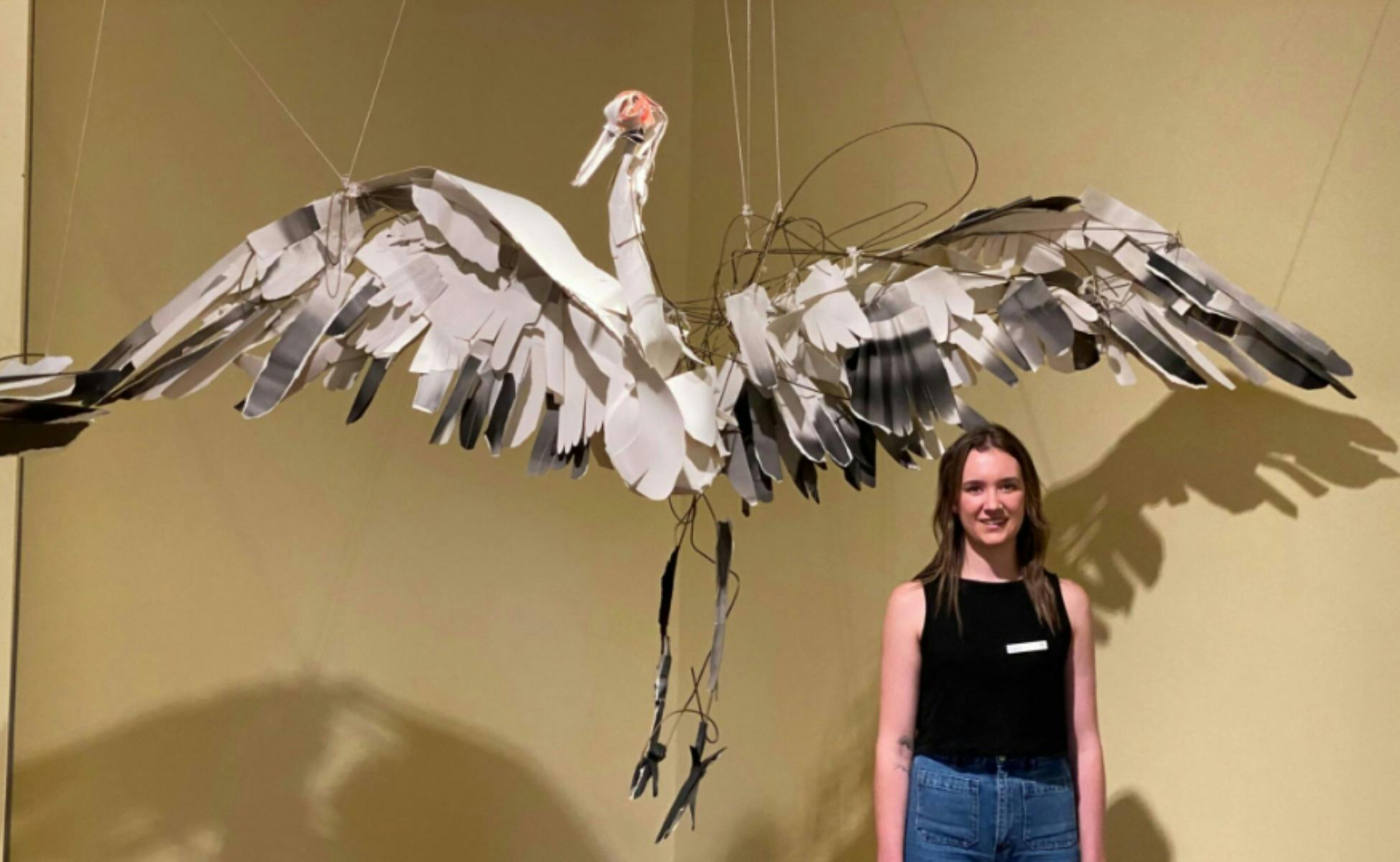 MRAG Art Educator with artwork by artist Anna Wili Highfield