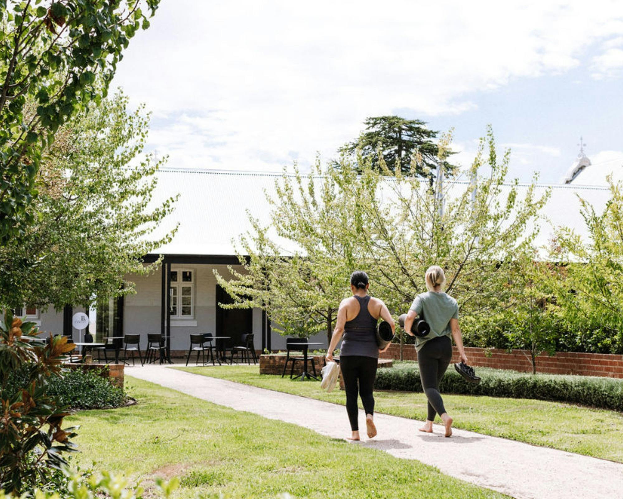 Ladies walking with yoga mats