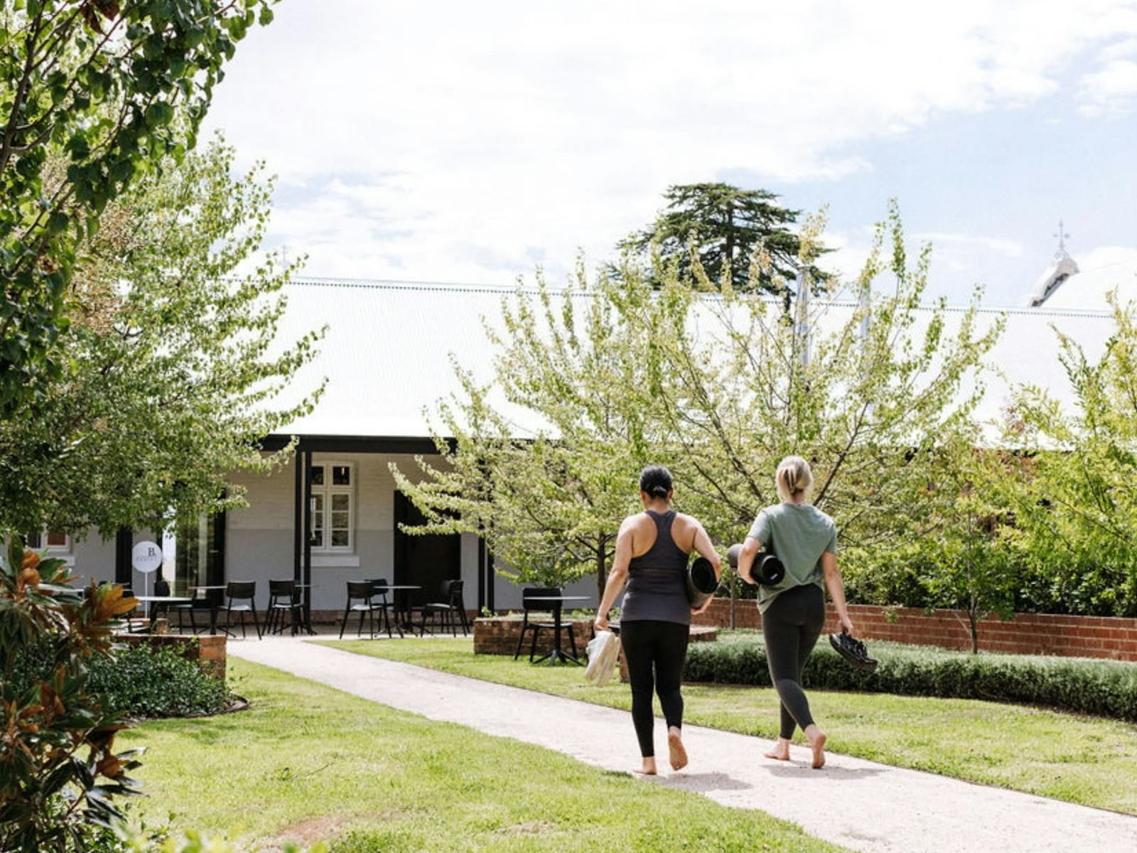 Ladies walking with yoga mats
