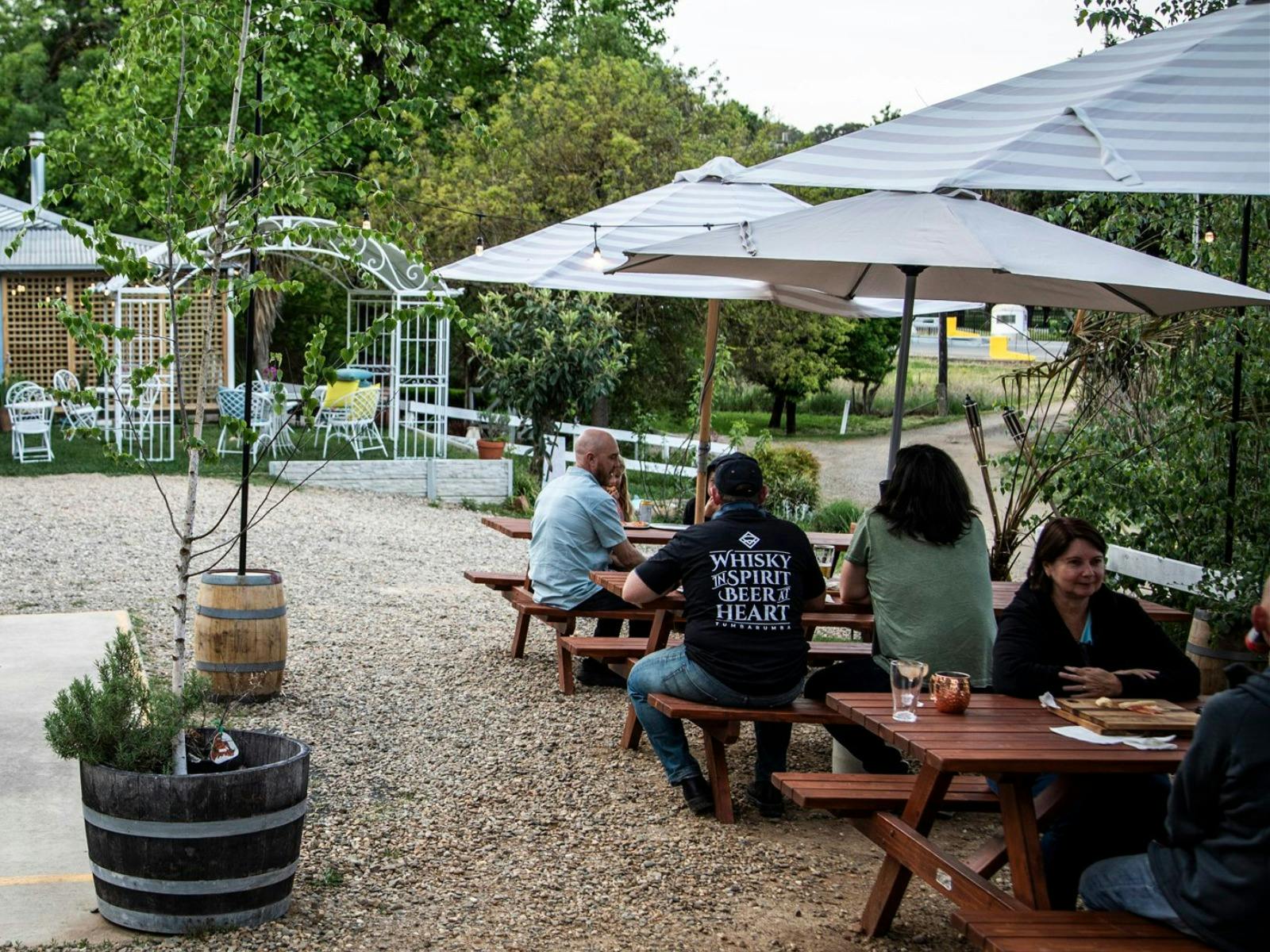 Enjoying stone baked pizzas in the beer garden seating area of the distillery cellar door tumbarumba