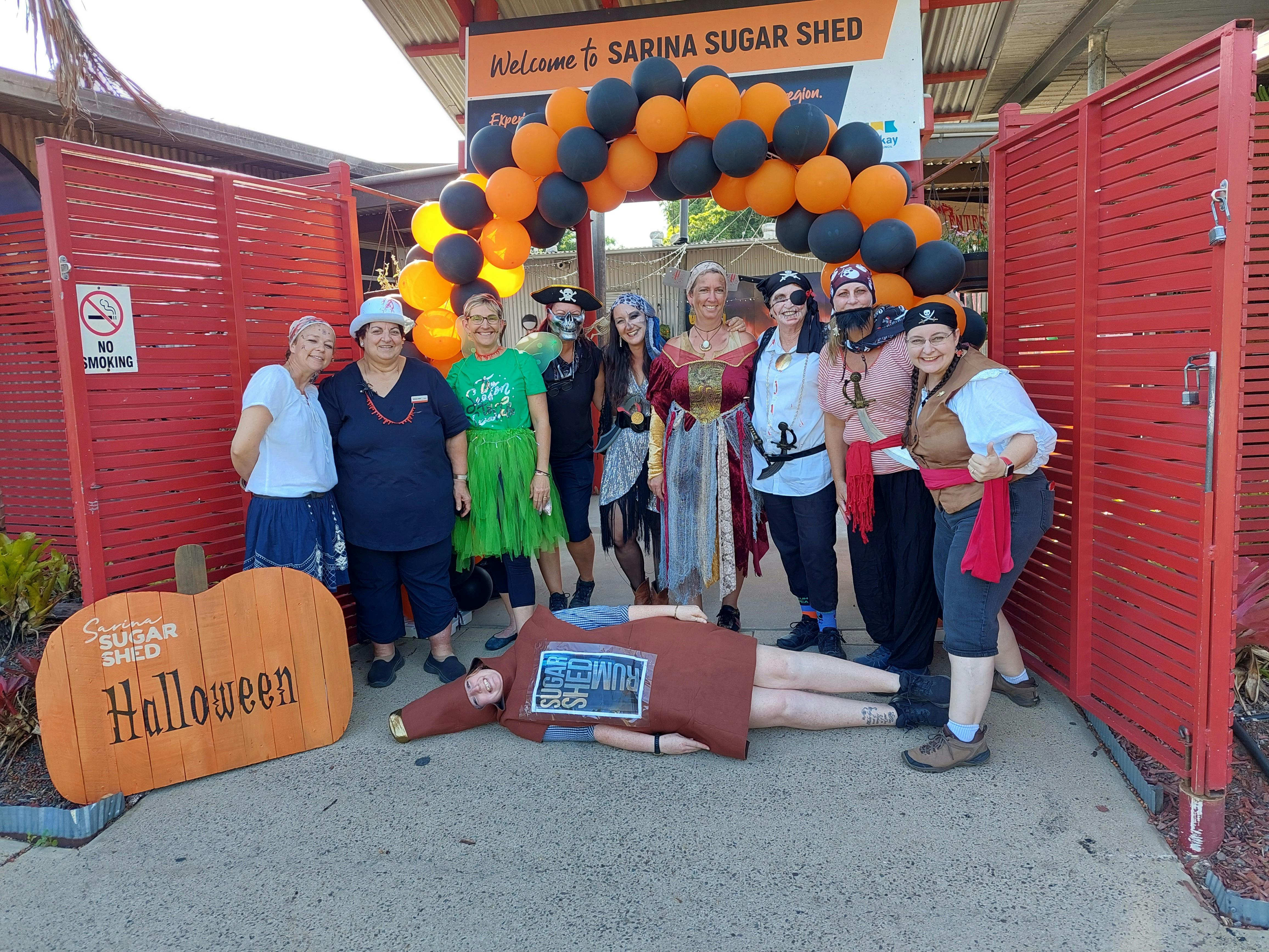 Sarina Sugar Sheds welcomes you for Halloween with staff dressed in Halloween costumes at entrance.