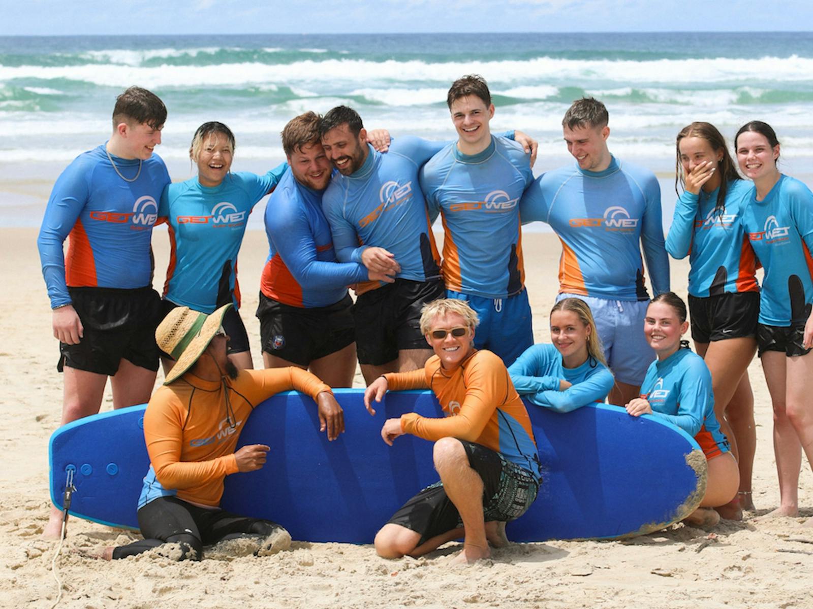 Fun group pic after completing their first surf lesson! Fun group pic after completing their first surf lesson!