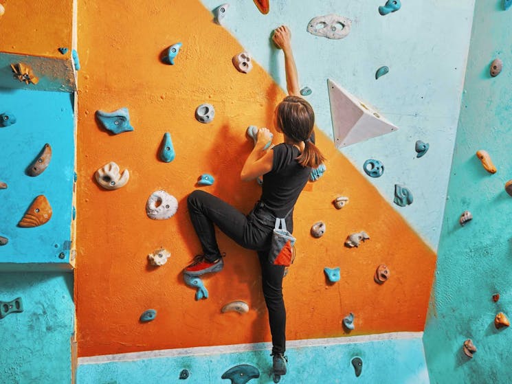 Image of girl rock climbing