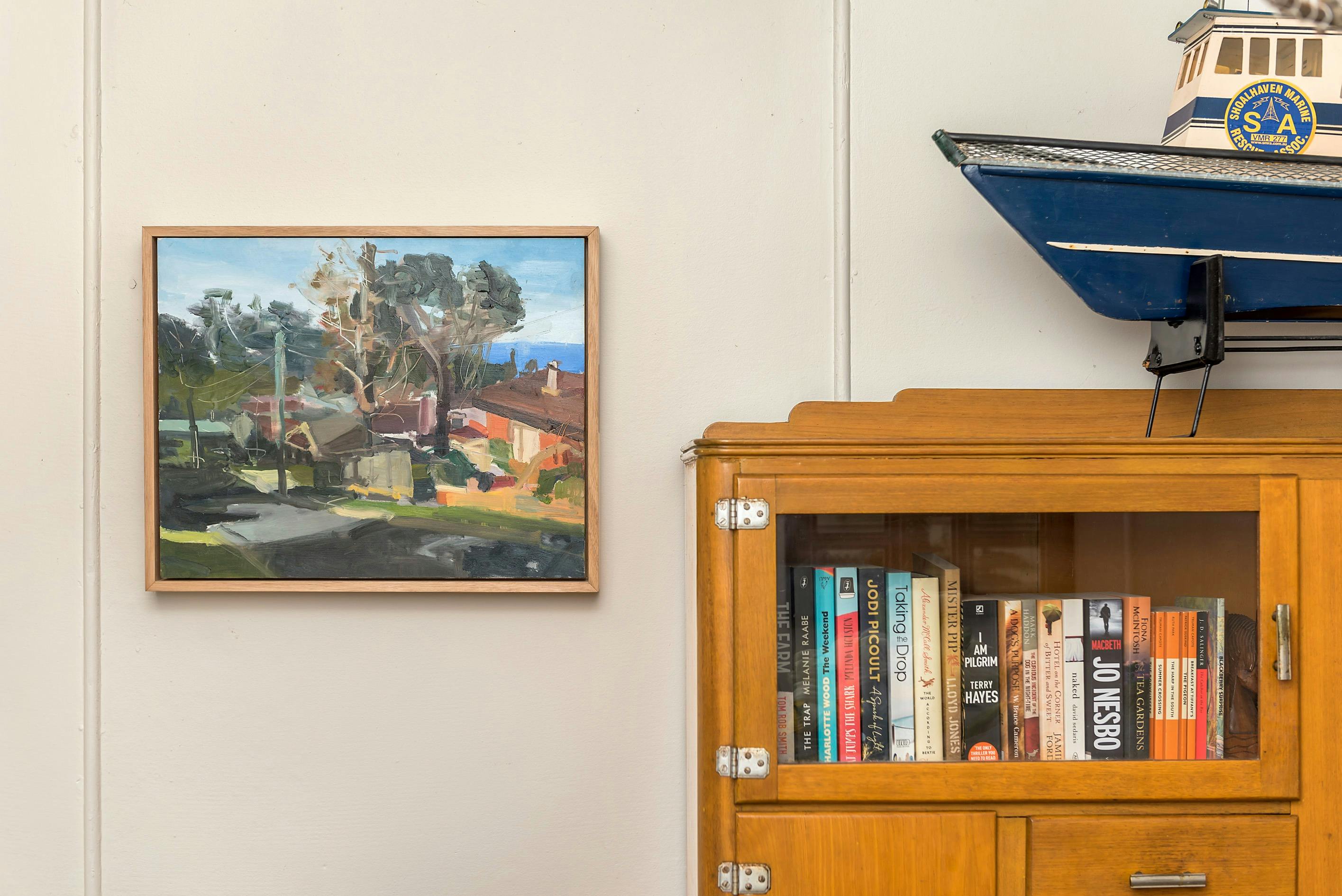 Third bedroom with queen bed and storage ottaman