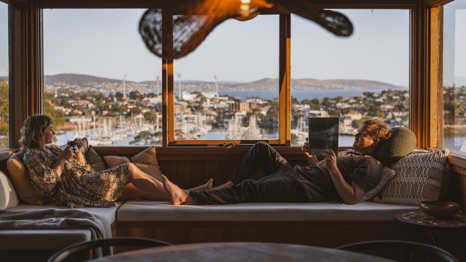 Lounge on the daybed and watch the sunset as day gives into night and lights shimmer on the water