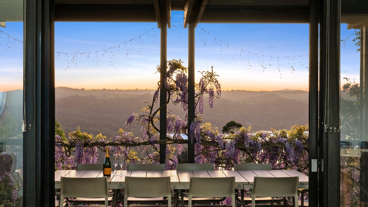 Outdoor dining on balcony with sweeping views