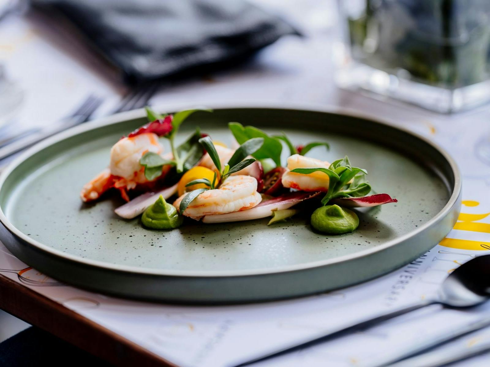 Green plate with prawn entree Green plate with prawn entree